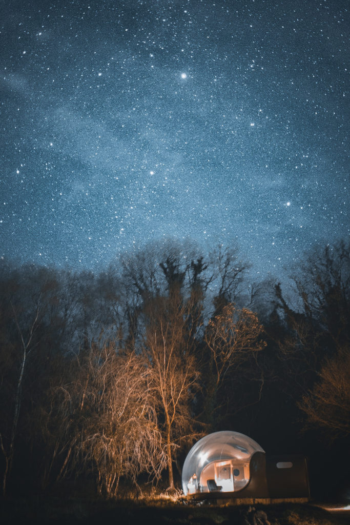 A glamping pod beneath a sky of stars