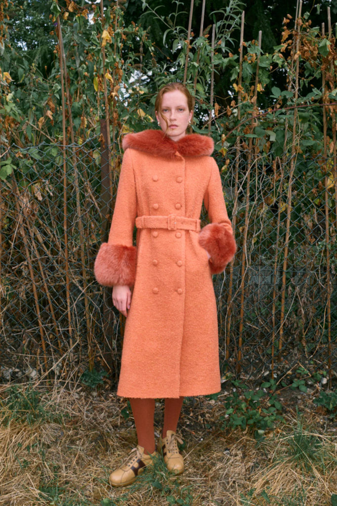 Woman in pink autumn/winter coat