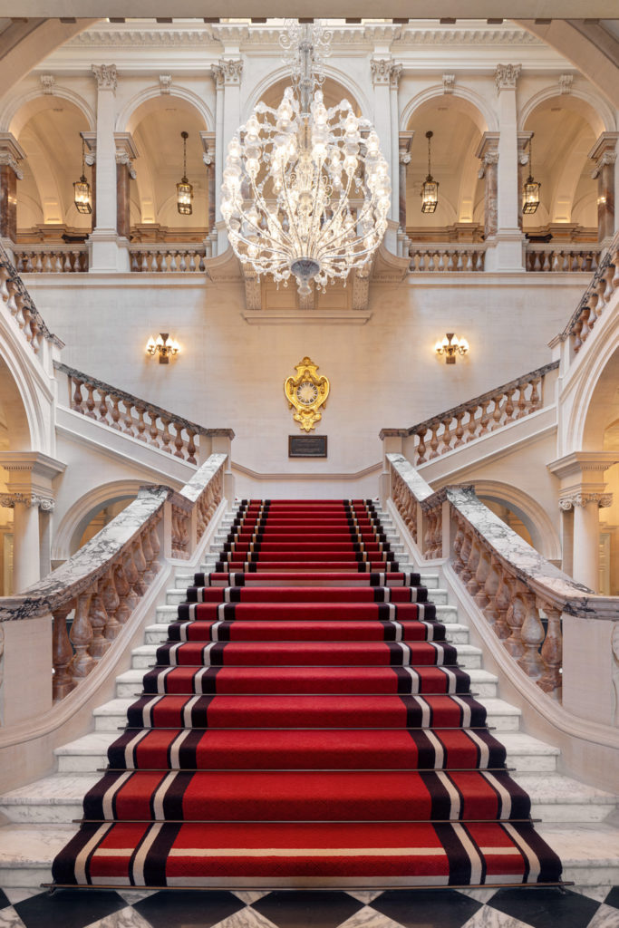 The staircase in the foyer at Raffles London at the OWO