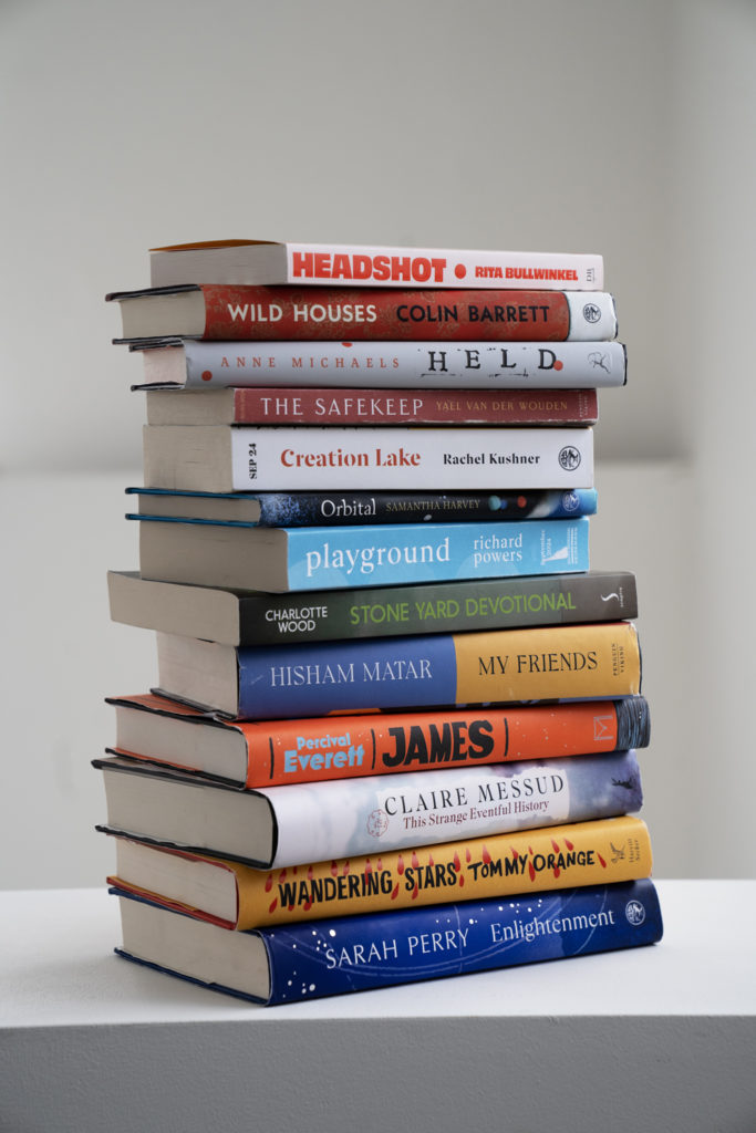 The longlist of 13 books on the long list for the Booker prize at the Chair of judges, Edmun De Waal's studio in South London