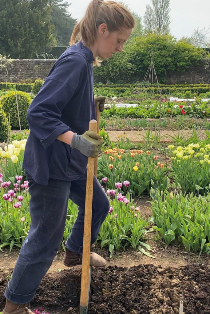 Woman digging a garden bed