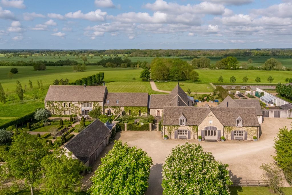 Aerial view of Cotswolds estate with driveway and landscaped gardens