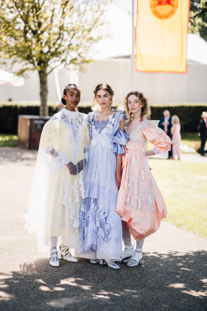 Three models wearing Bora Aksu dresses