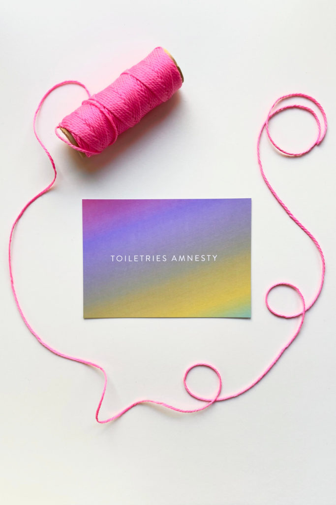 Toiletries Amnesty card with pink thread