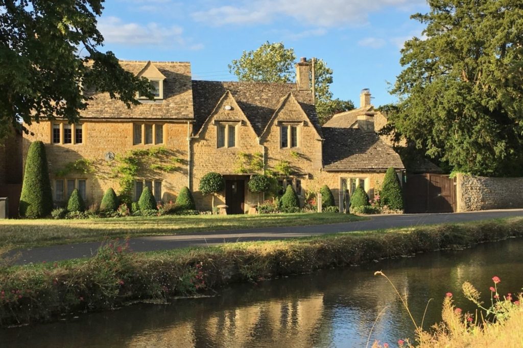 Wisteria-clad Cotswold stone house on the riverside
