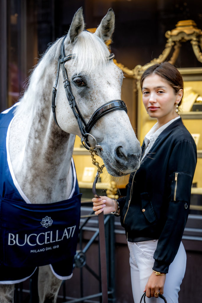 Buccellati Sponsors Goodwood Festival image of model holding horse wearing Buccellati rug