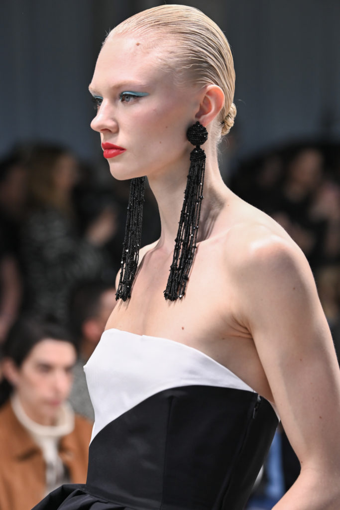 Close up of model with long earrings