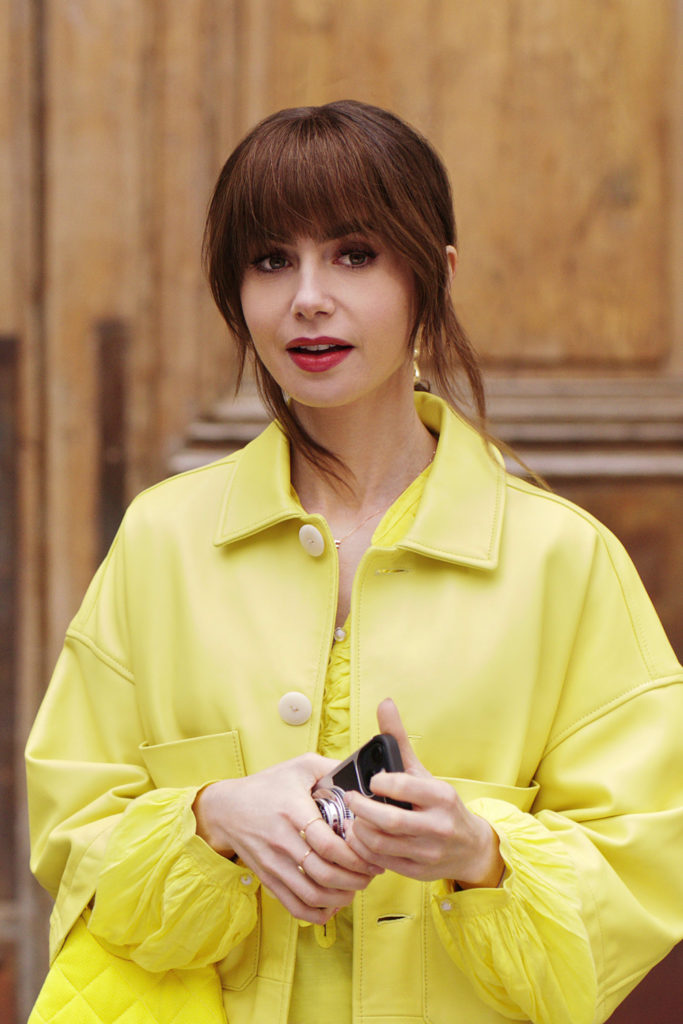 Lily Collins in yellow outfit for Emily in Paris