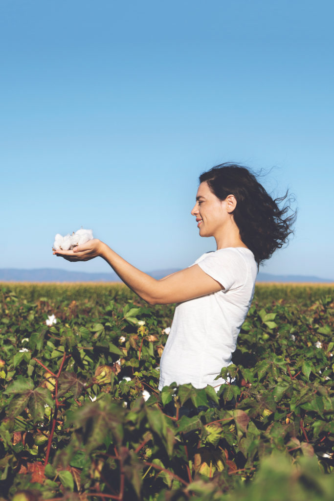 Woman is holding natural cotton interiors fabrics