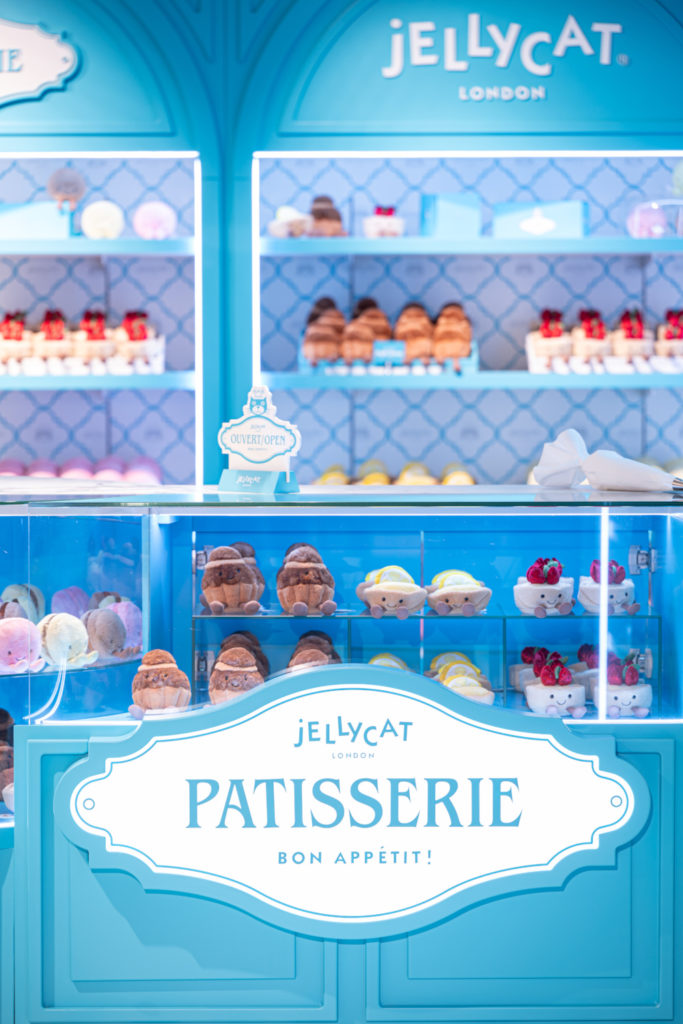 Jellycat Patisserie Paris - blue cake display case in shop set up with soft toys