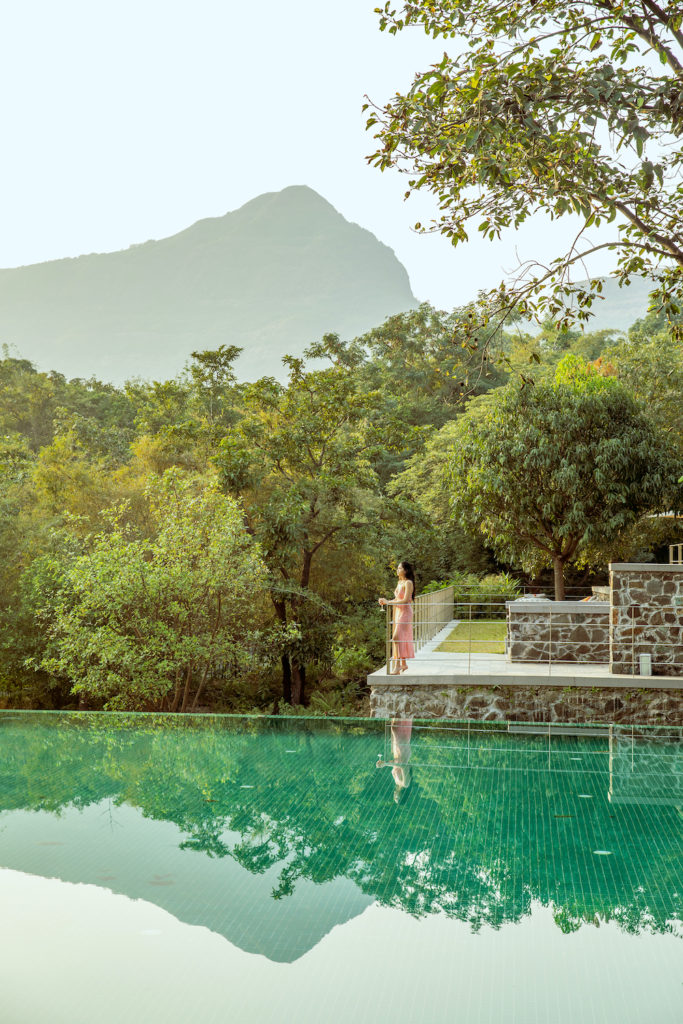 Woman by swimming pool at Dharana at Shillim