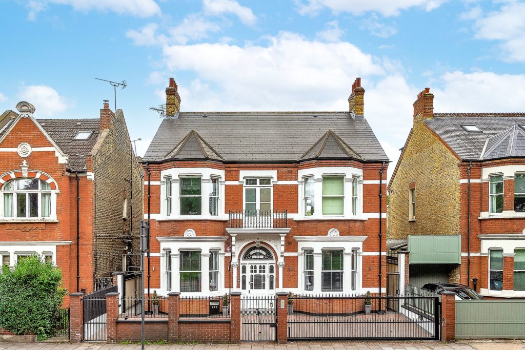 Double-fronted, detached red brick home