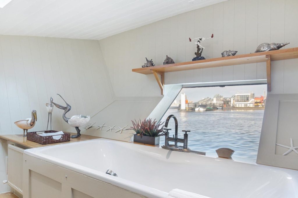 Houseboat bathroom with views over the river