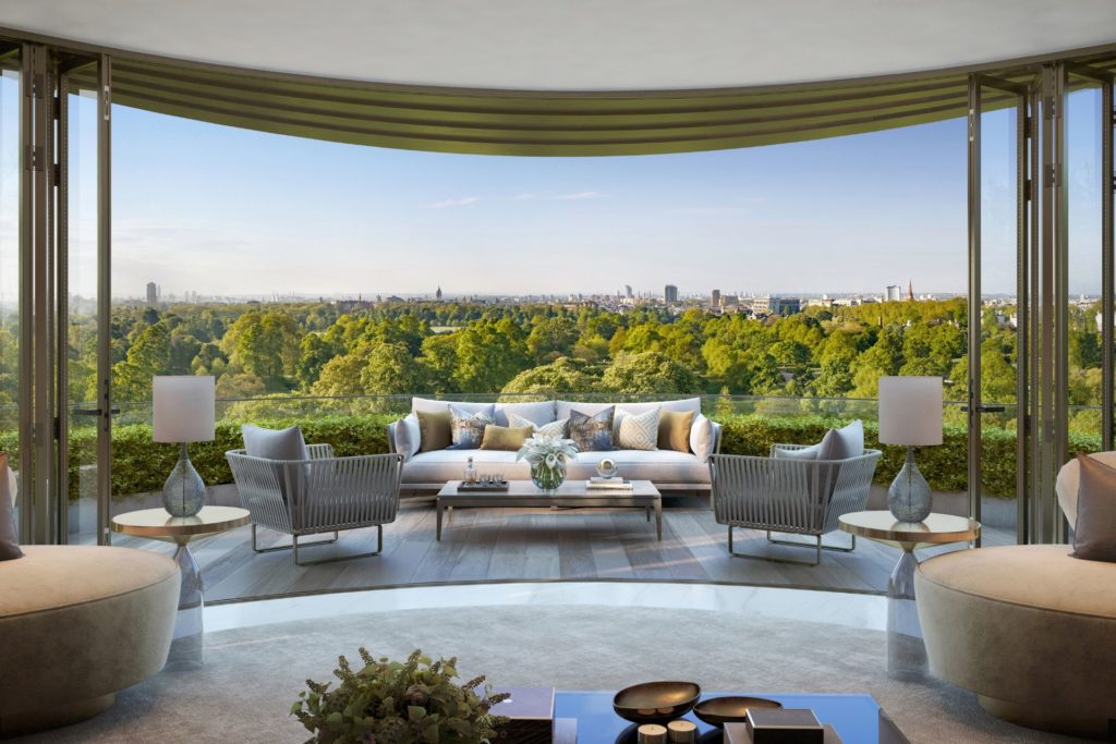 Penthouse living room with curved glass windows overlooking Hyde Park