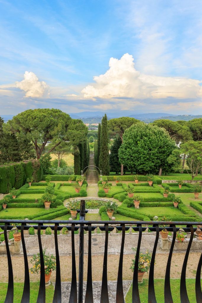 Balcony overlooking garden with landscaped hedges