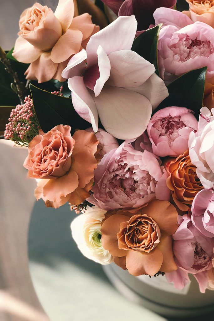 A vase of pink hued flowers