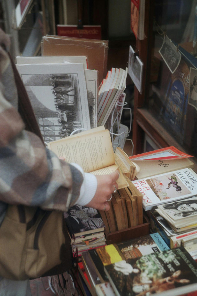 A person browsing second hand books