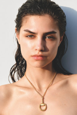 Model wearing Gucci Horsebit chain necklace