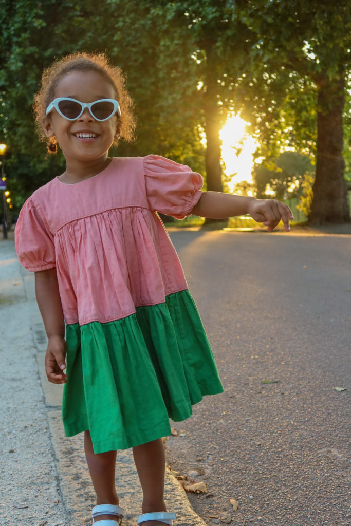 Girl in pink and green dress