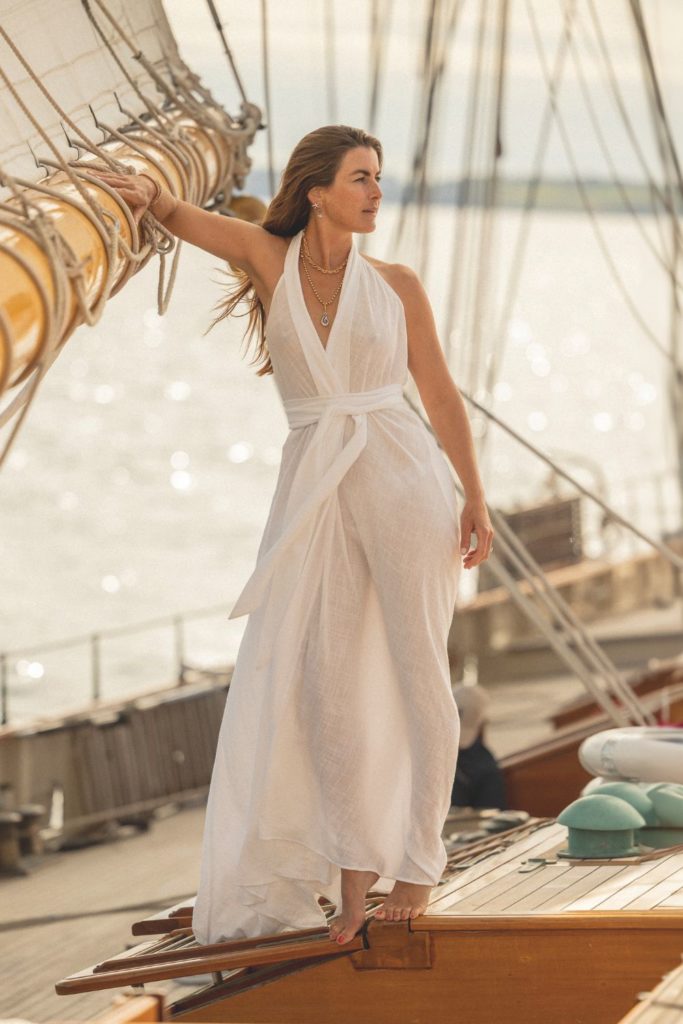 Fee Drummond wearing a white dress on a boat