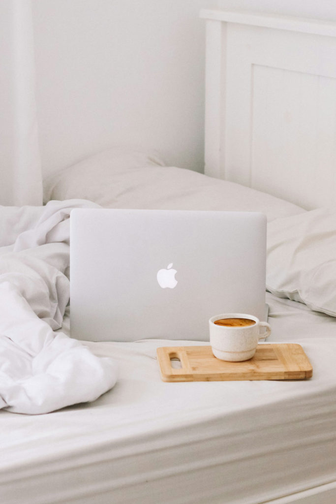 Mac laptop in bed