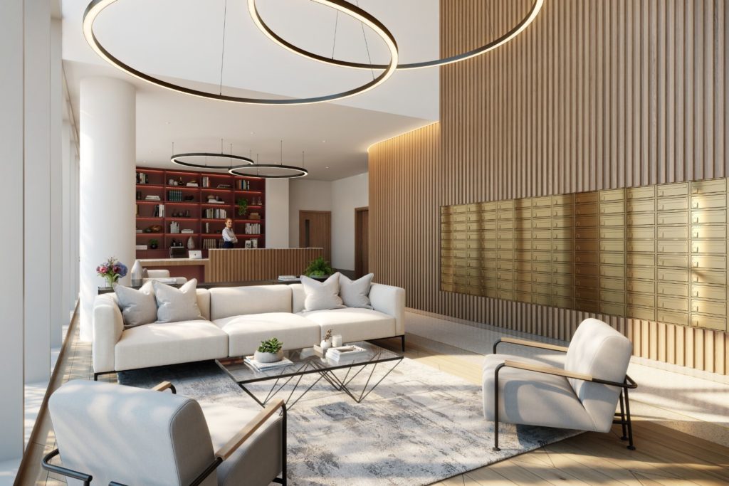 Lobby with circular light pendant and cream sofas, with wood-panelled walls