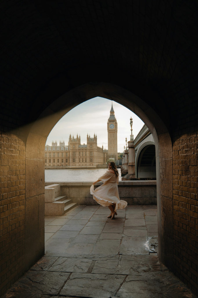 A woman in front of the Big Ben clock tower